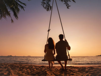 romantic-couple-sunset-beach-swing