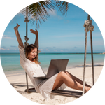 woman working on beach with laptop image